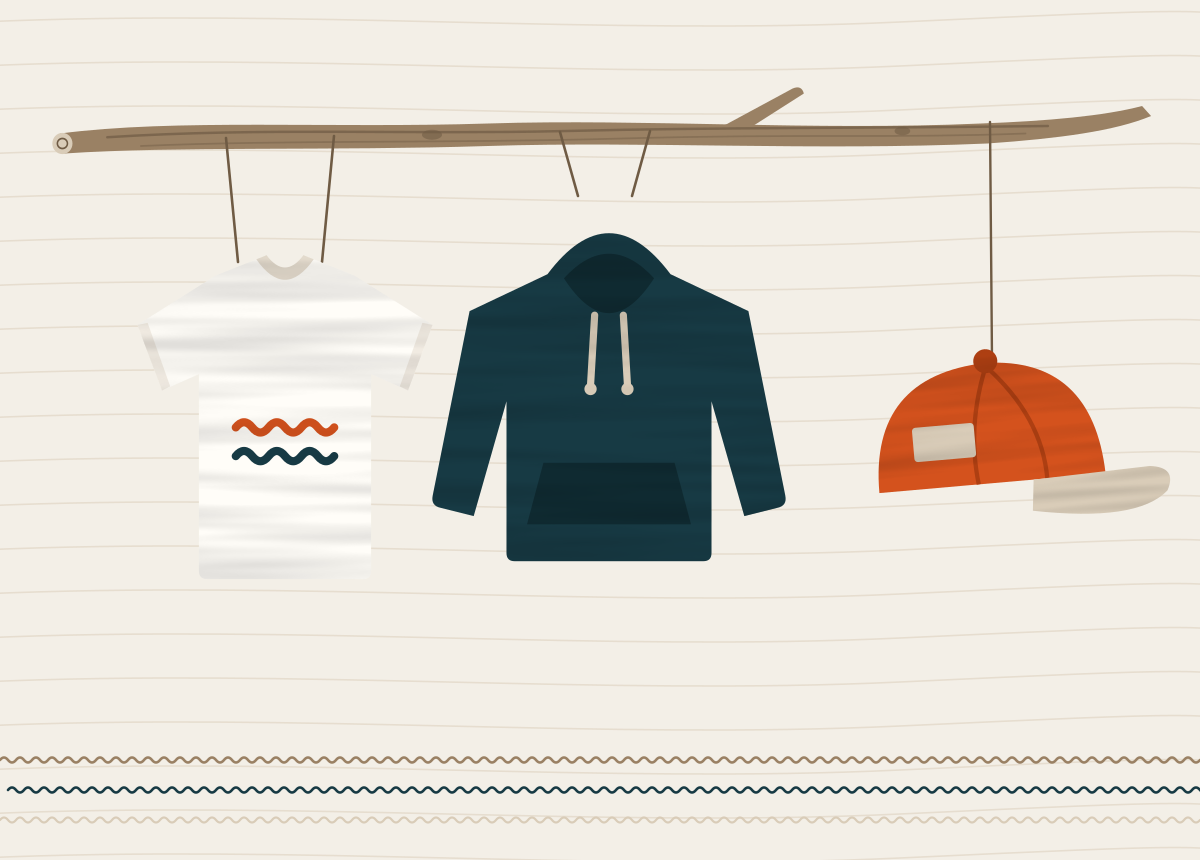 Home 1 A white T-shirt, a navy hoodie and an orange cap hanging from a piece of driftwood